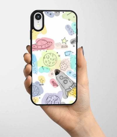 A hand holding a glass phone case with a colorful design.