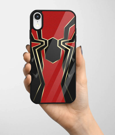 A hand holding a glass phone case with a colorful design.