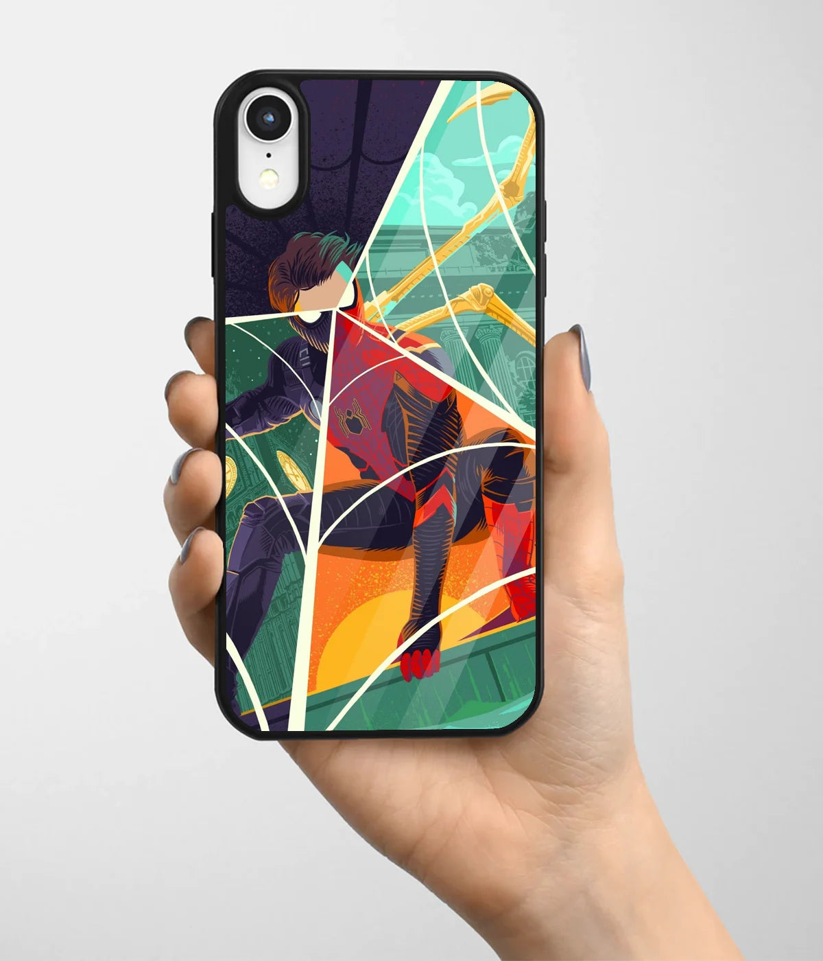 A hand holding a glass phone case with a colorful design.