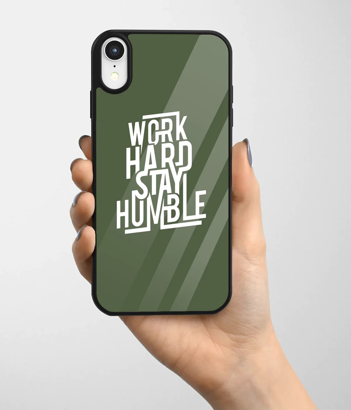 A hand holding a glass phone case with a colorful design.