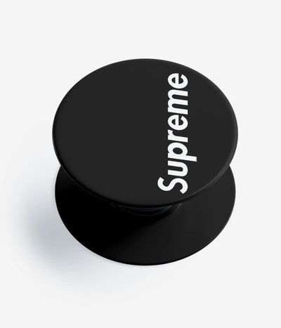 A top-down view of a phone grip holder on a clean white background