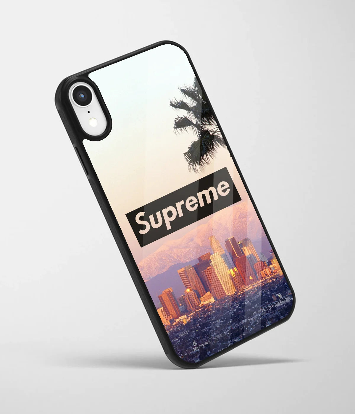 An angled view of a glass phone case featuring a vibrant design.