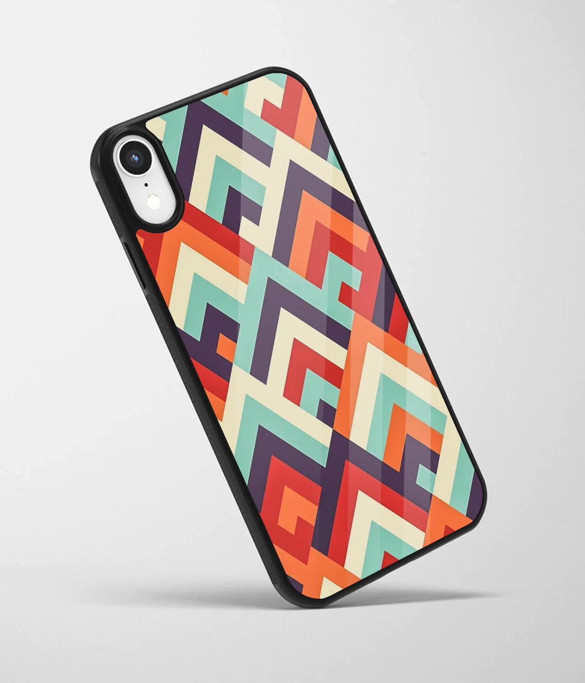 An angled view of a glass phone case featuring a vibrant design.