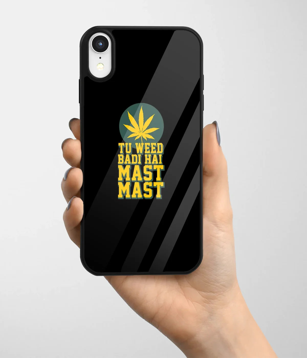 A hand holding a glass phone case with a colorful design.