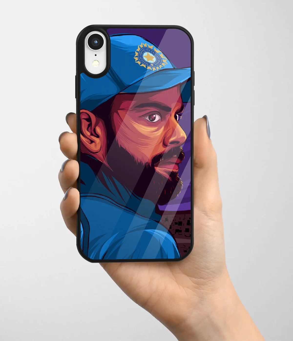 A hand holding a glass phone case with a colorful design.