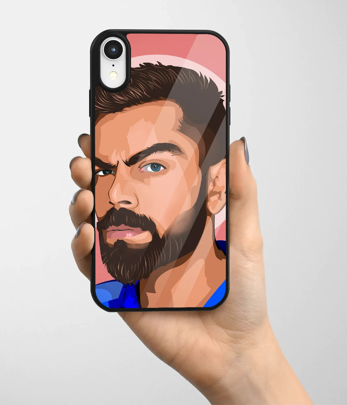 A hand holding a glass phone case with a colorful design.