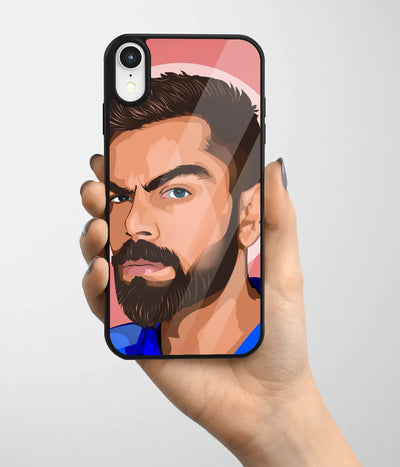 A hand holding a glass phone case with a colorful design.