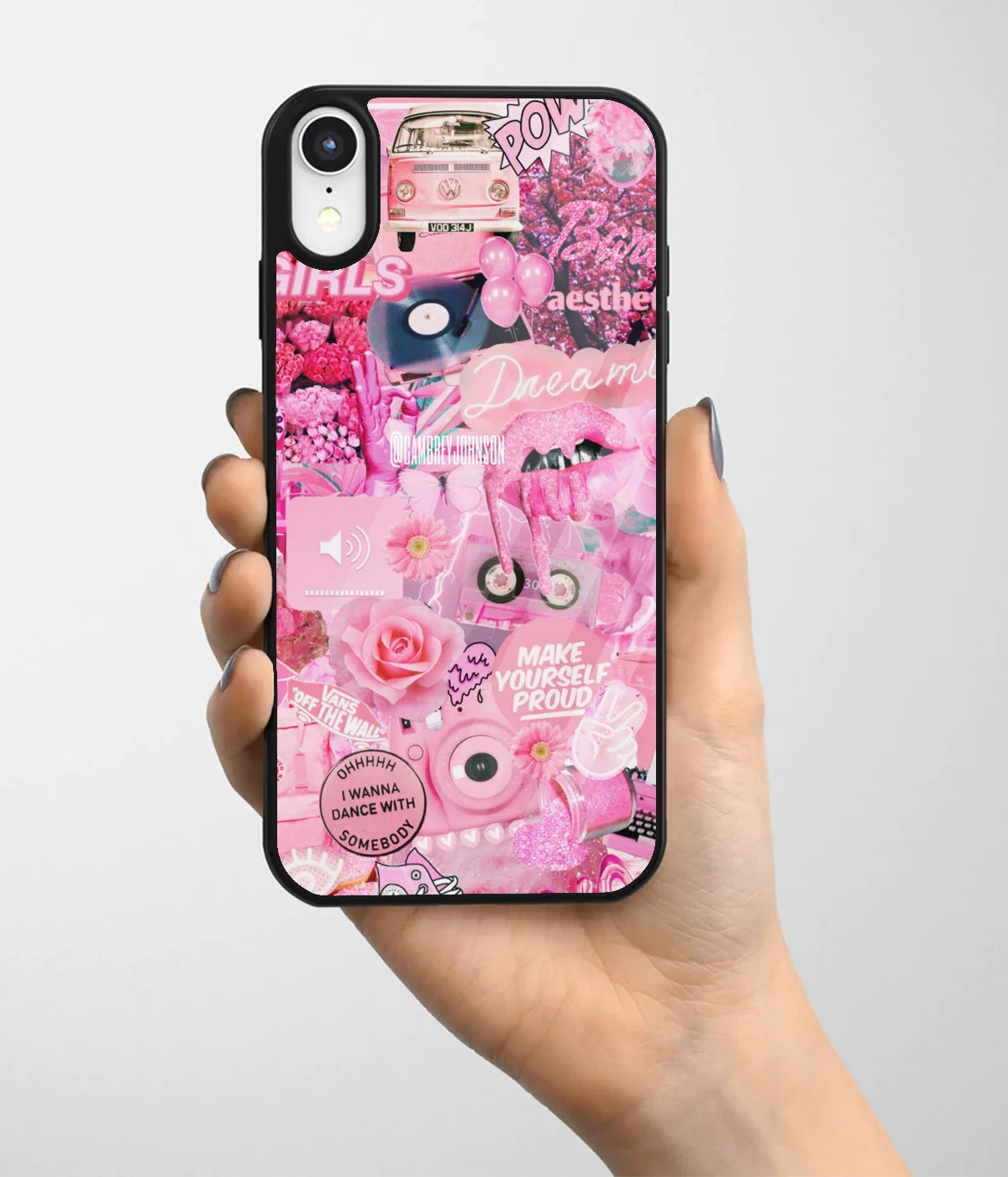 A hand holding a glass phone case with a colorful design.