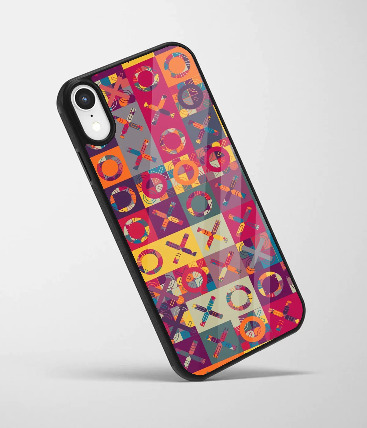 An angled view of a glass phone case featuring a vibrant design.