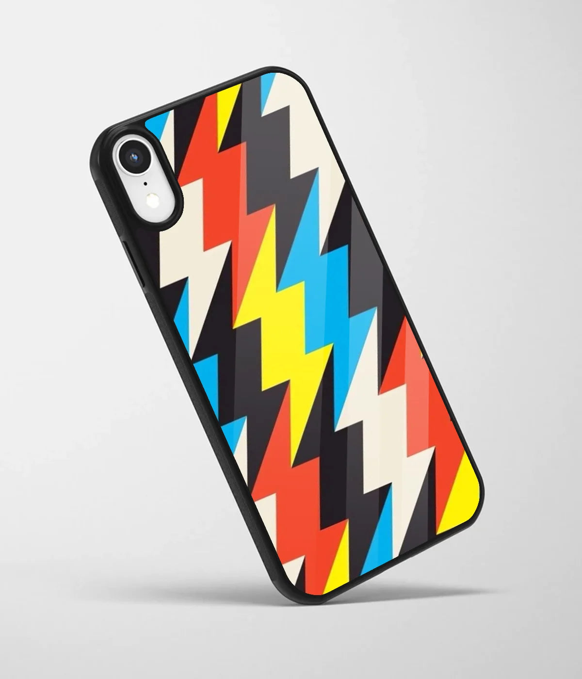 An angled view of a glass phone case featuring a vibrant design.
